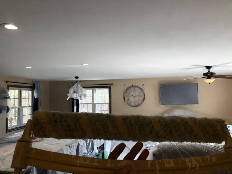 After: open great room and kitchen ceilings and walls painted