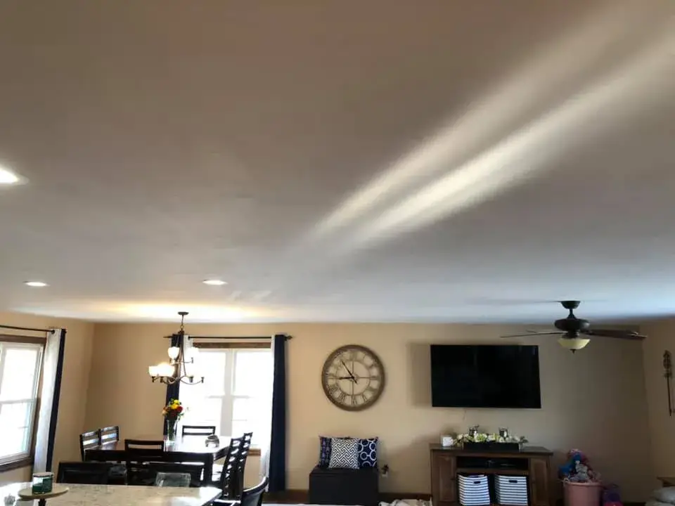 After: open great room and kitchen ceilings and walls painted