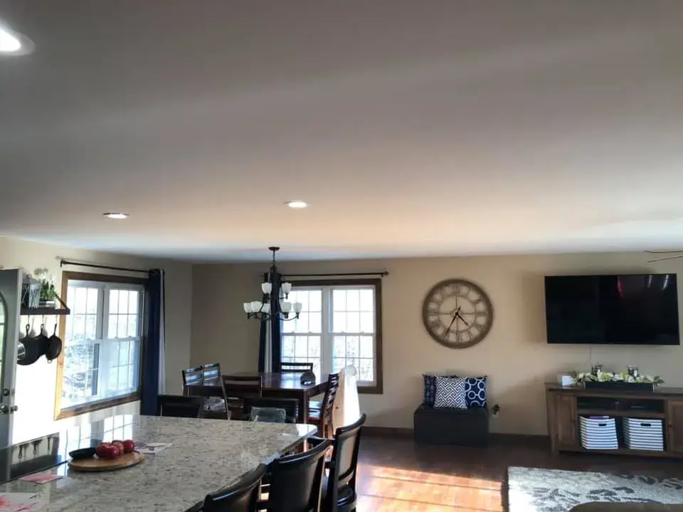 After: open great room and kitchen ceilings and walls painted