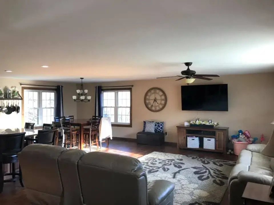 After: open great room and kitchen ceilings and walls painted