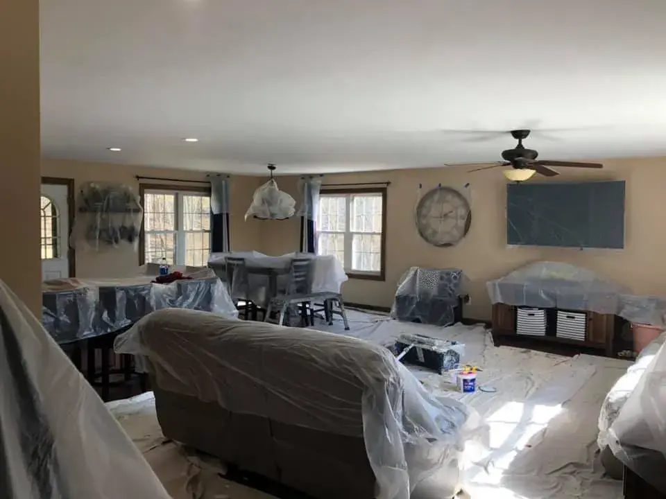 In progress: open great room and kitchen ceilings and walls painted