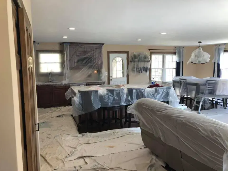 In progress: open great room and kitchen ceilings and walls painted