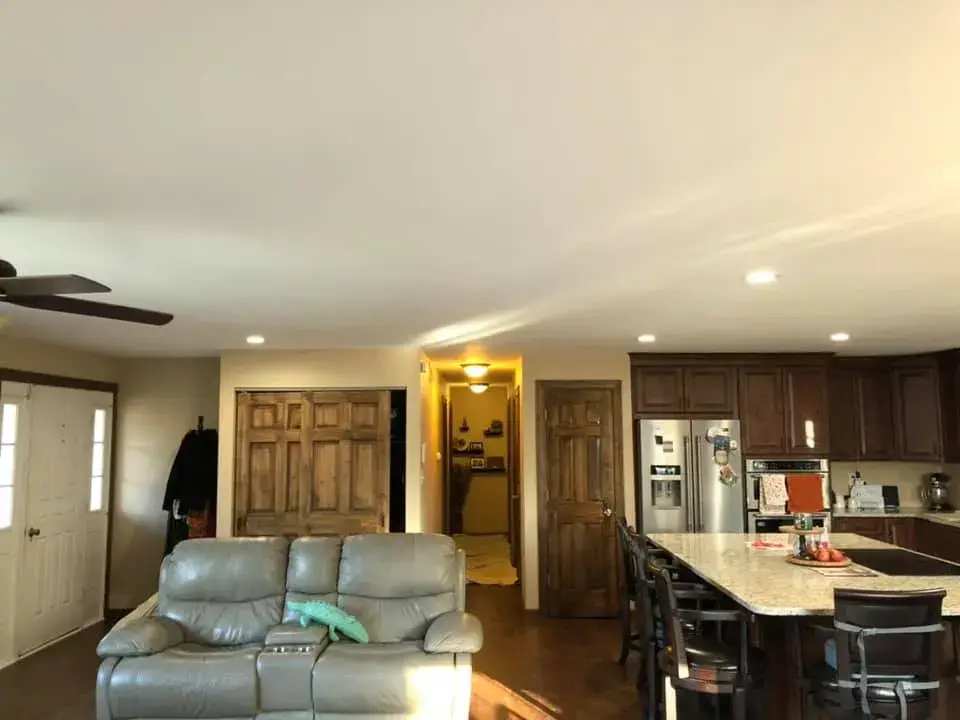 In progress: open great room and kitchen ceilings and walls painted