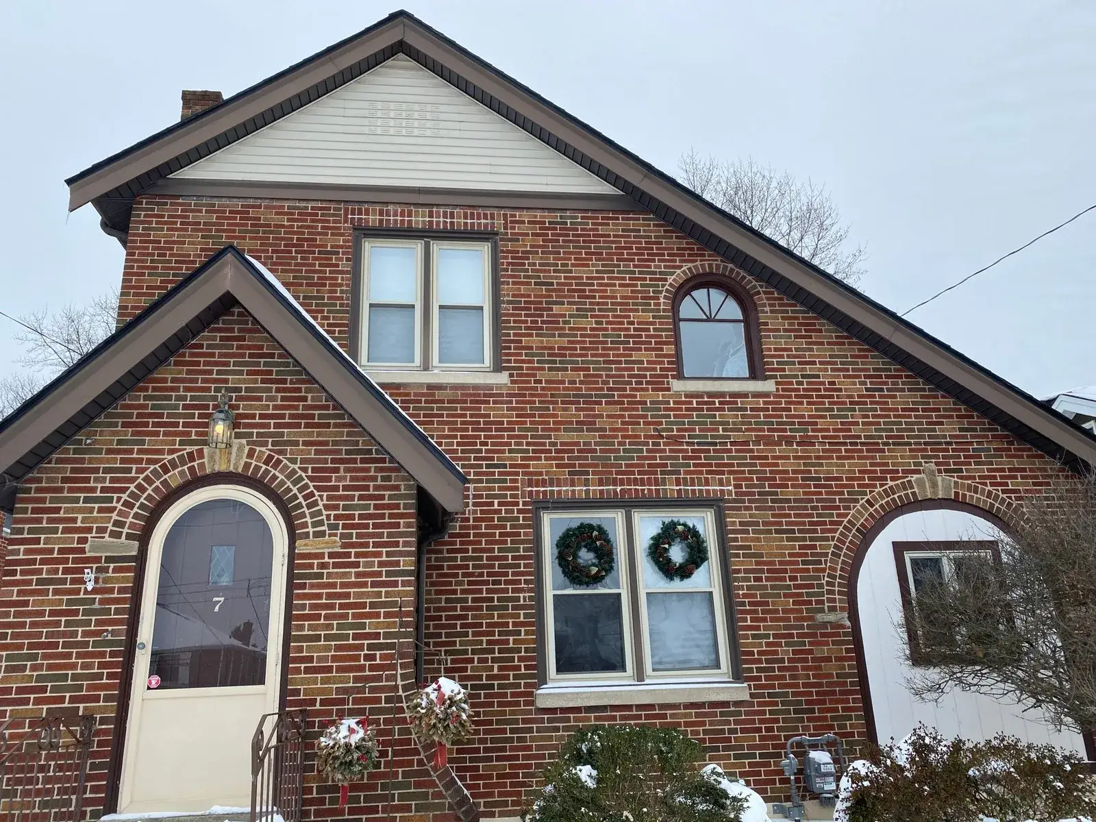 Before: red brick cottage painted beige