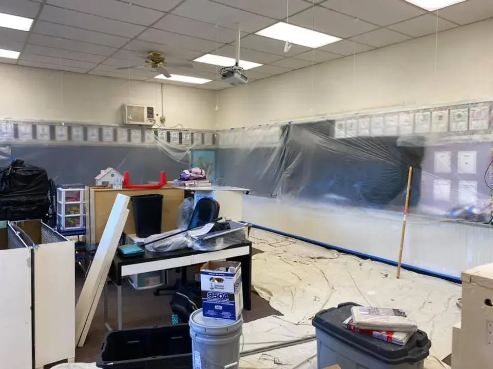 Before: school: classrooms with blue wainscot and an office