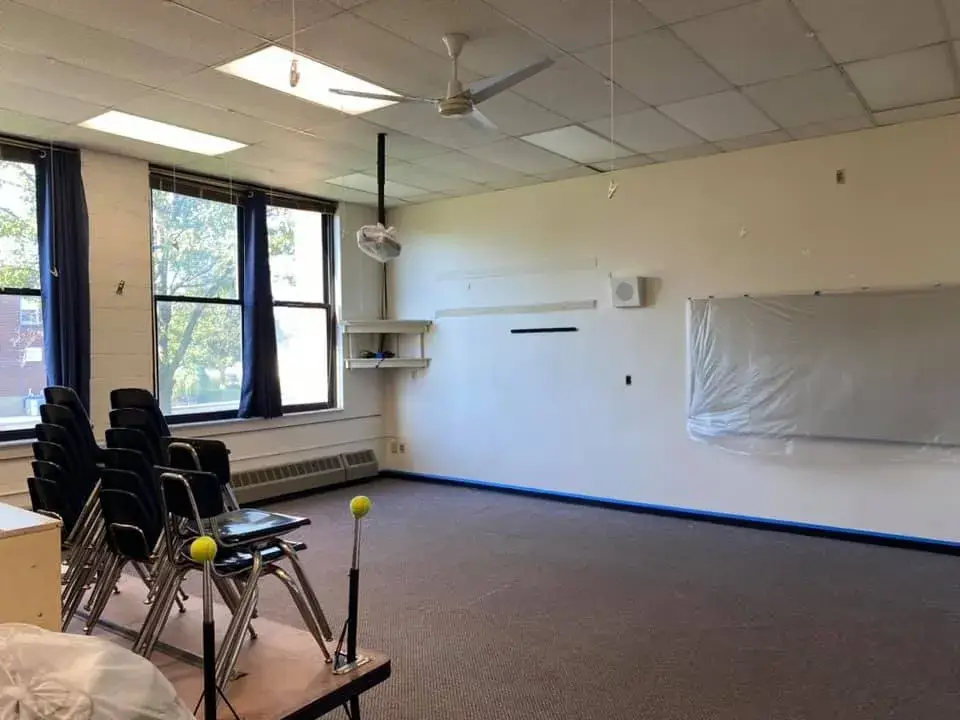 In progress: school: classrooms with blue wainscot and an office
