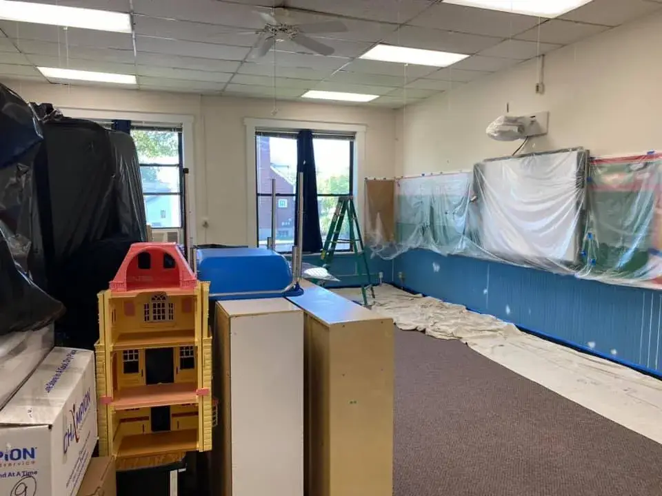 In progress: school: classrooms with blue wainscot and an office