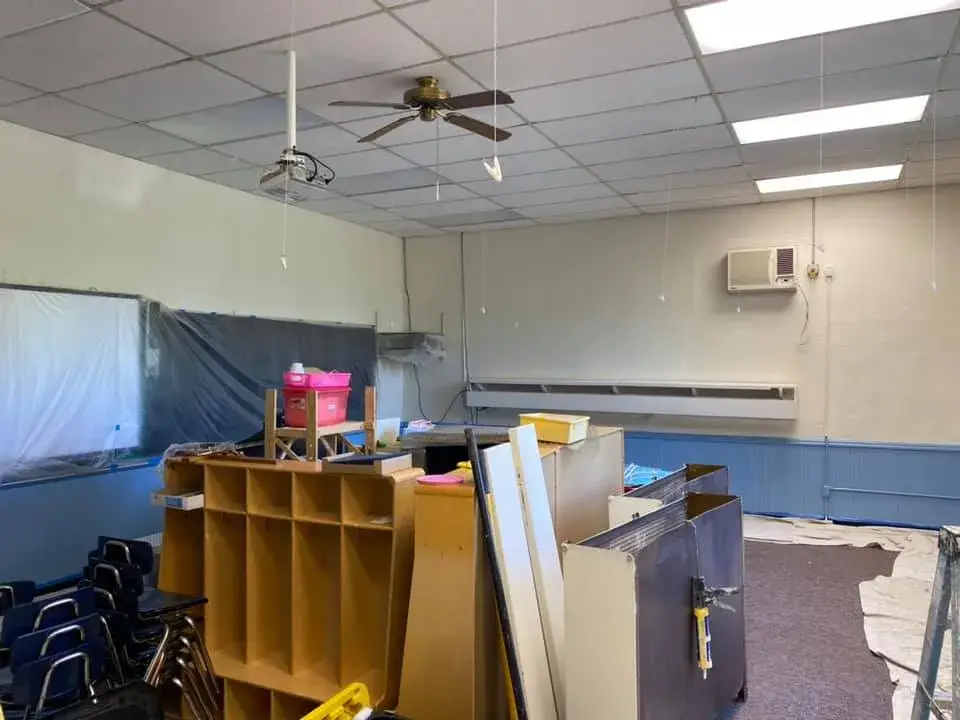 In progress: school: classrooms with blue wainscot and an office