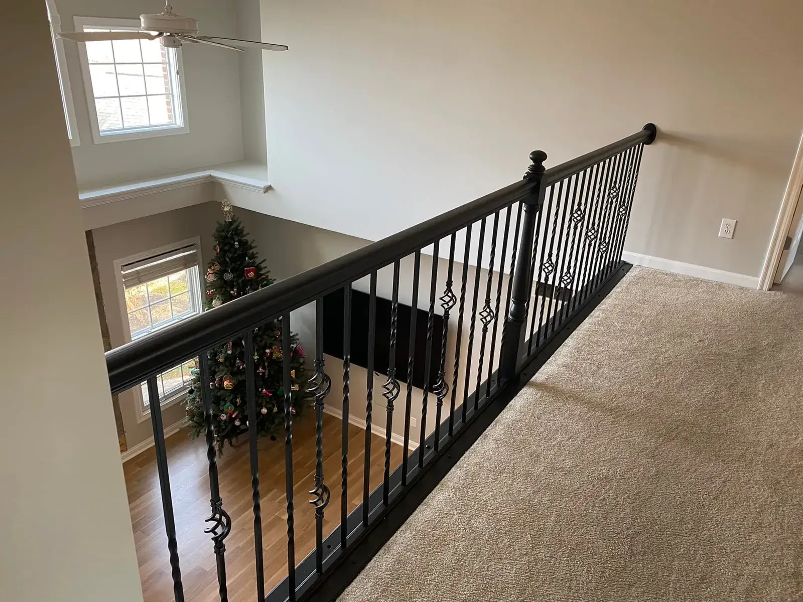 After: staircase and balcony railing: oak to black, plus dining room