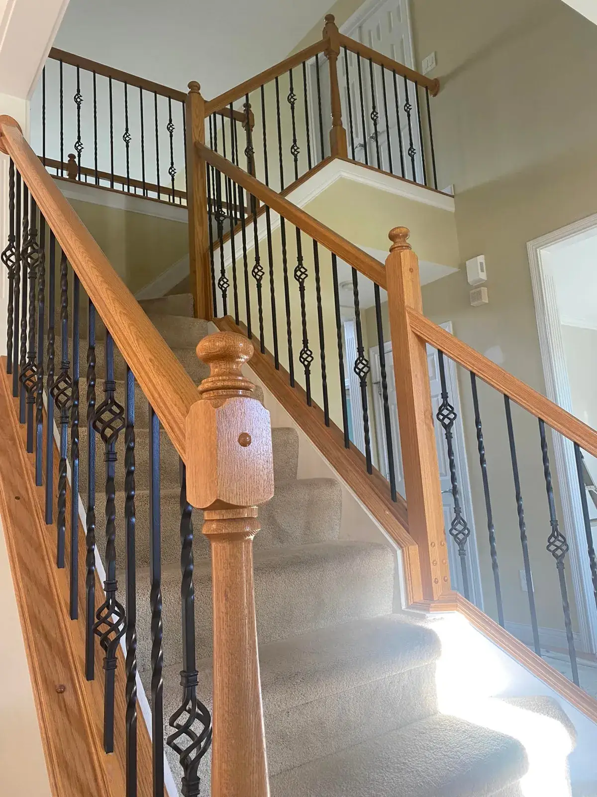 Before: staircase and balcony railing: oak to black, plus dining room