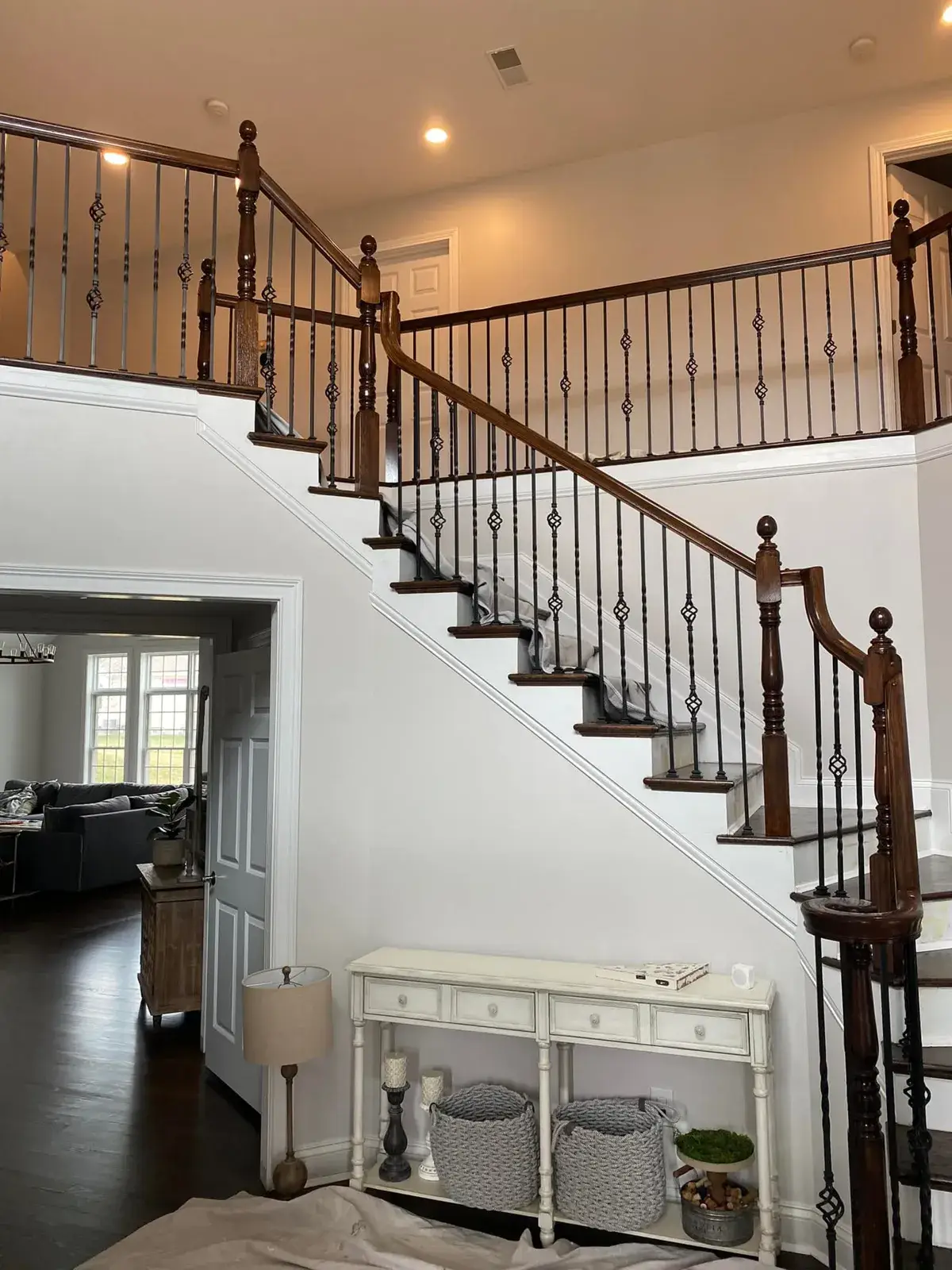 After: staircase: oak handrail and newels refinished dark