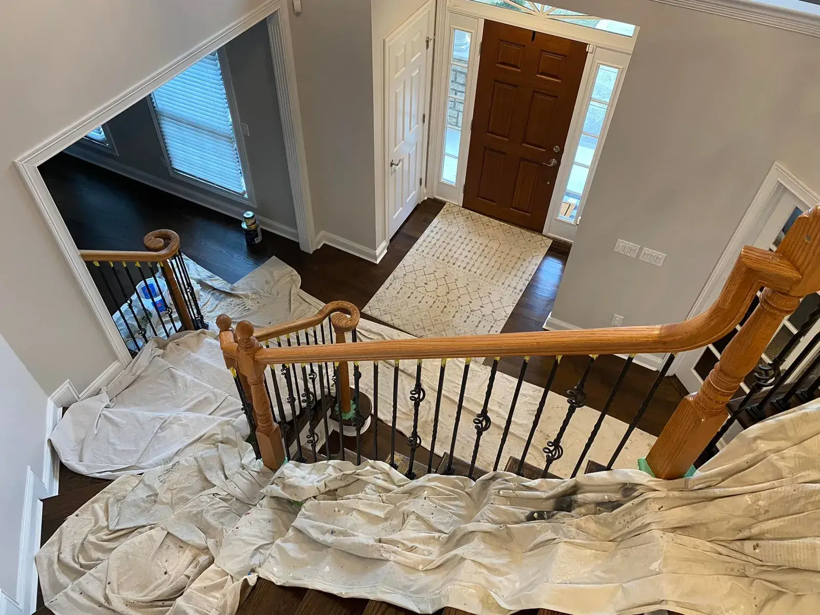 Before: staircase: oak handrail and newels refinished dark