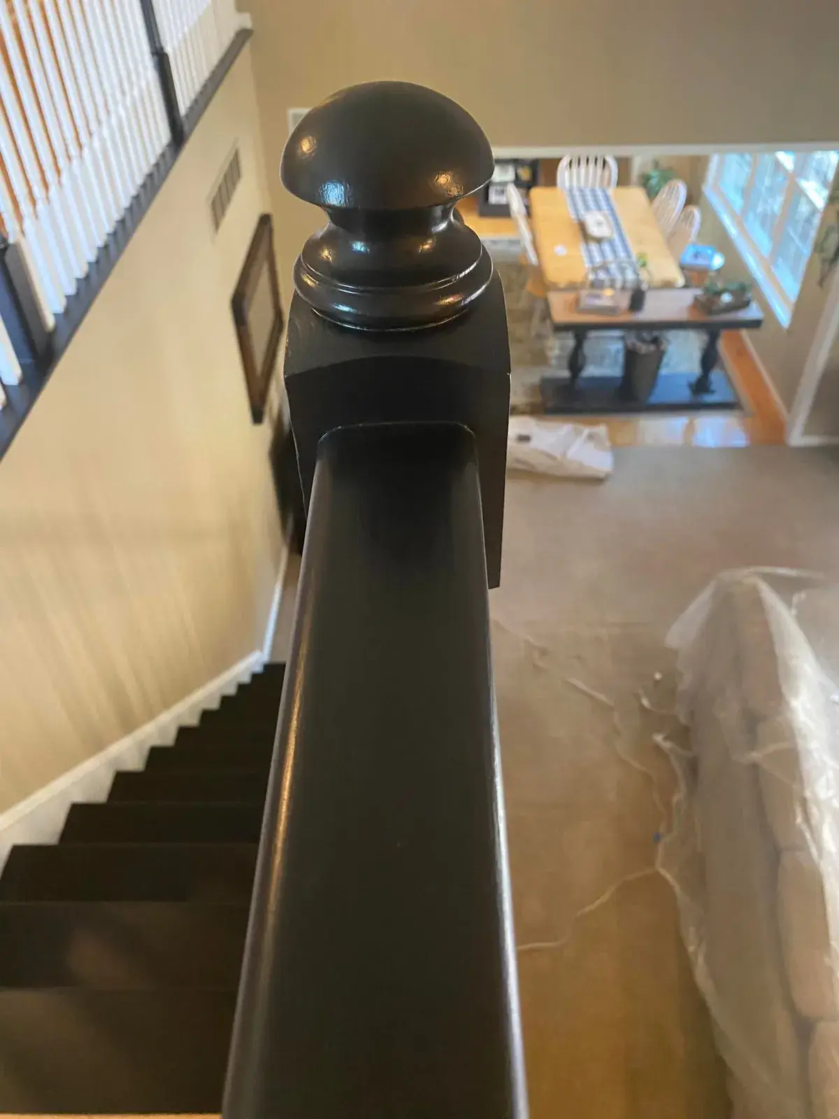After: staircase: oak railing painted black with white spindles and black treads