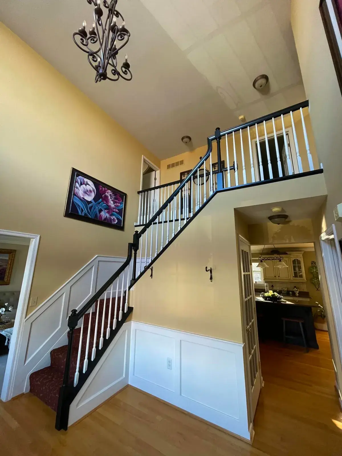 After: staircase: oak railing painted black with white spindles and black treads