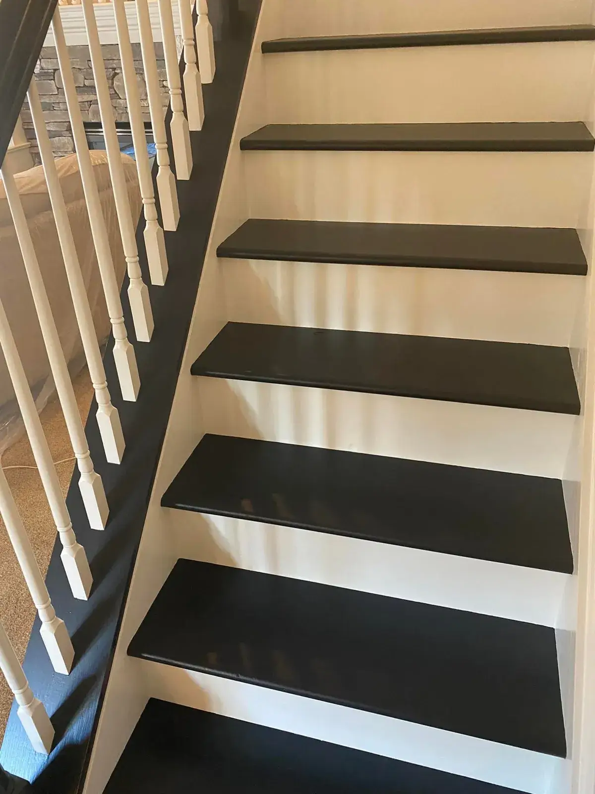 Staircase with black treads and white risers and railings. - My Personal Painter - My Personal Painter After: staircase: oak railing painted black with white spindles and black treads