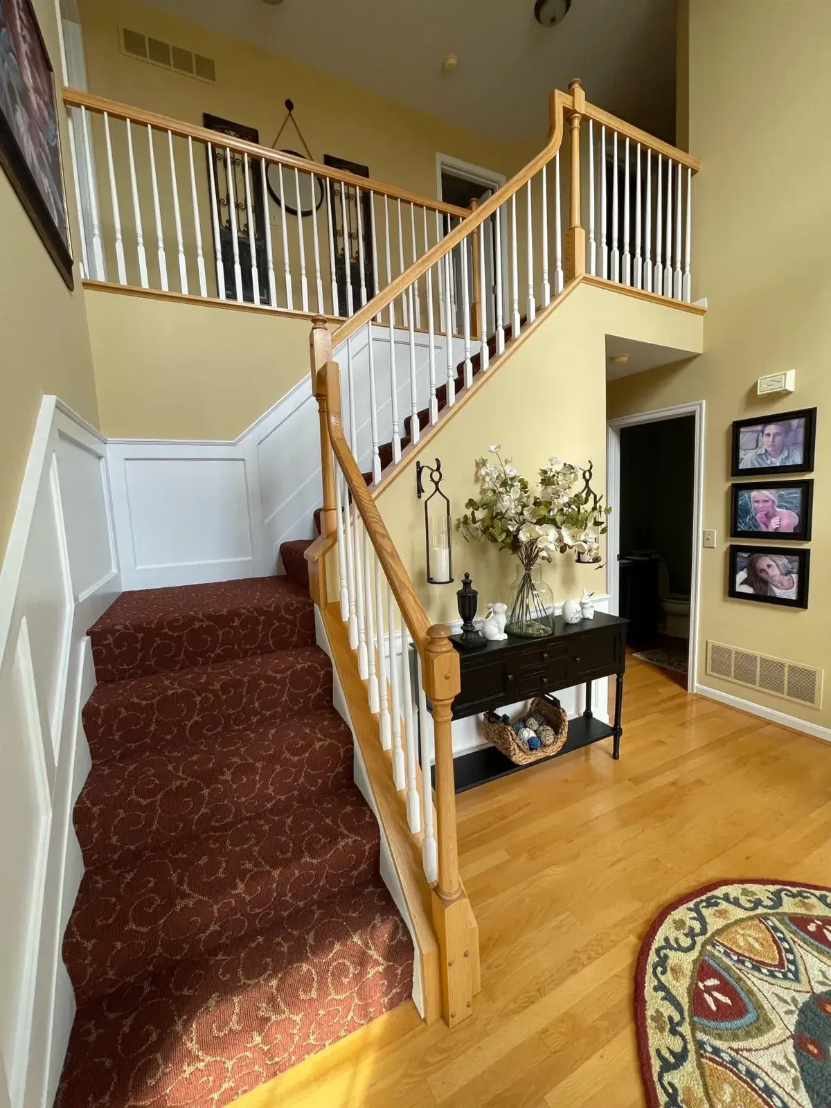 Before: staircase: oak railing painted black with white spindles and black treads