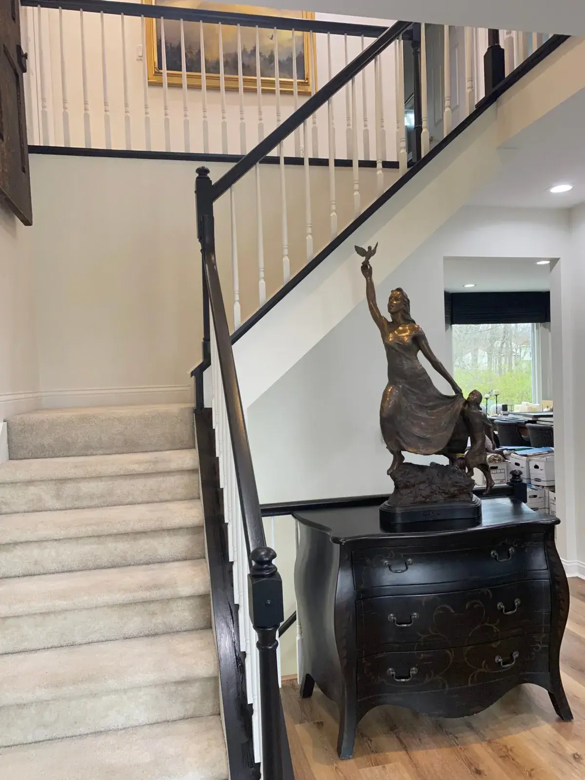 After: staircase railing painted black