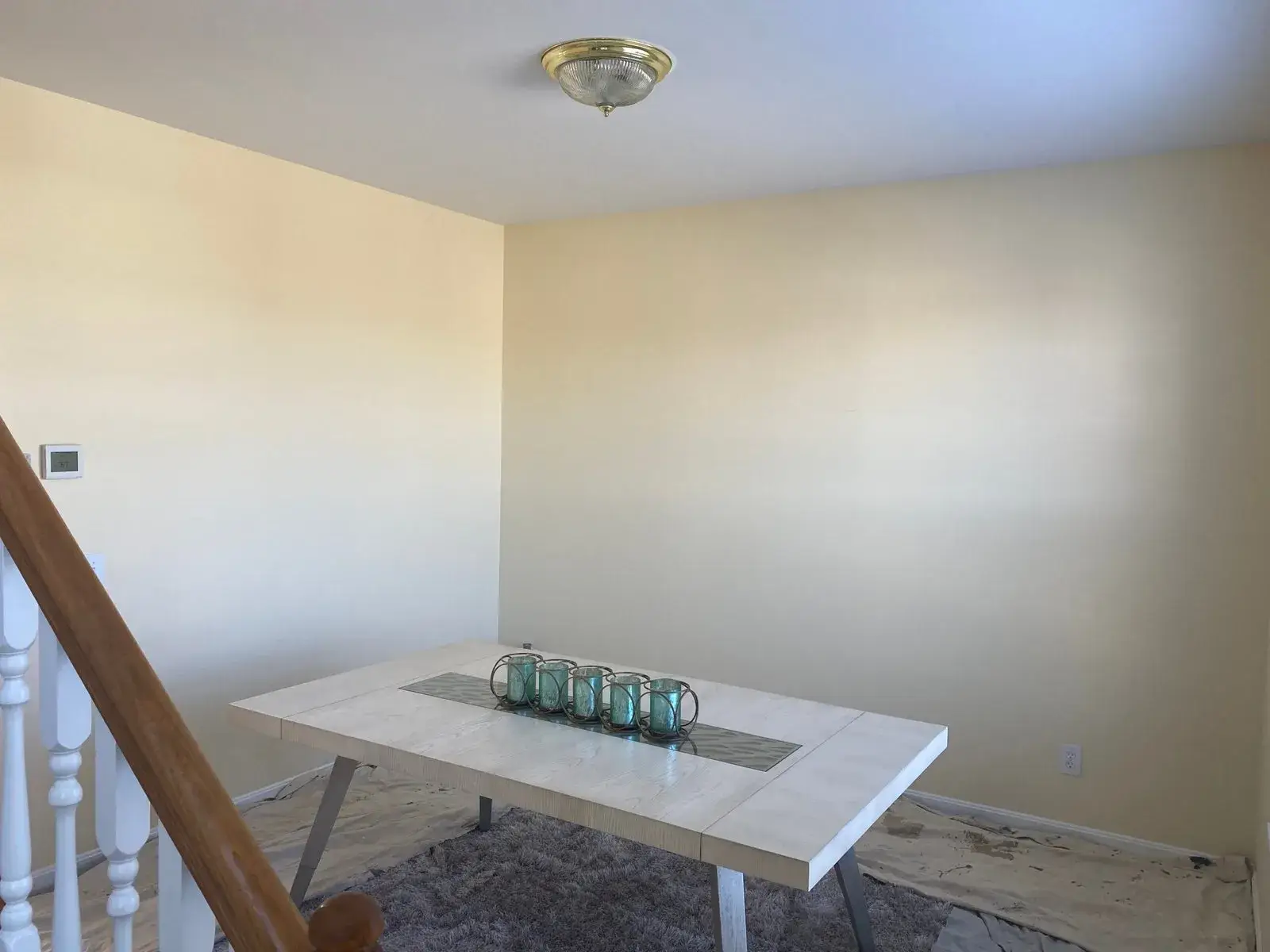 After: staircase with black spindles, dining room and bedroom stripes, bathroom vanity