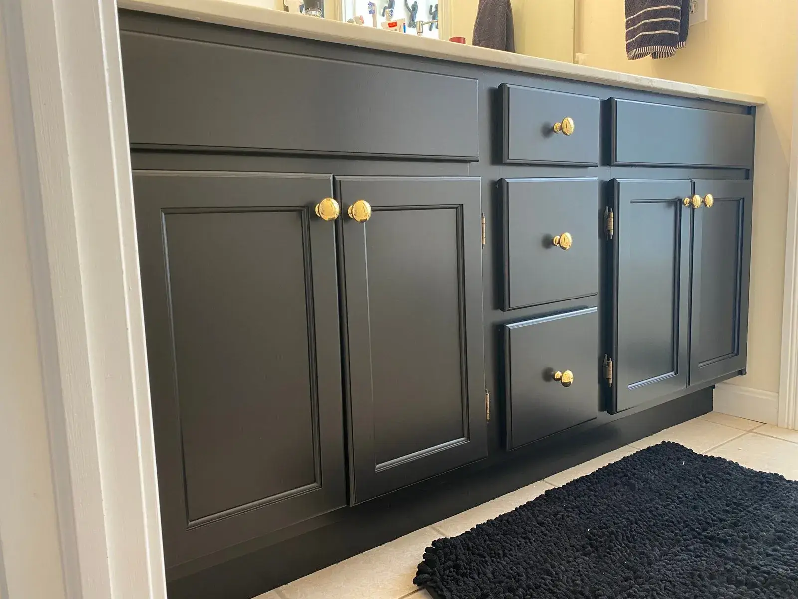 After: staircase with black spindles, dining room and bedroom stripes, bathroom vanity