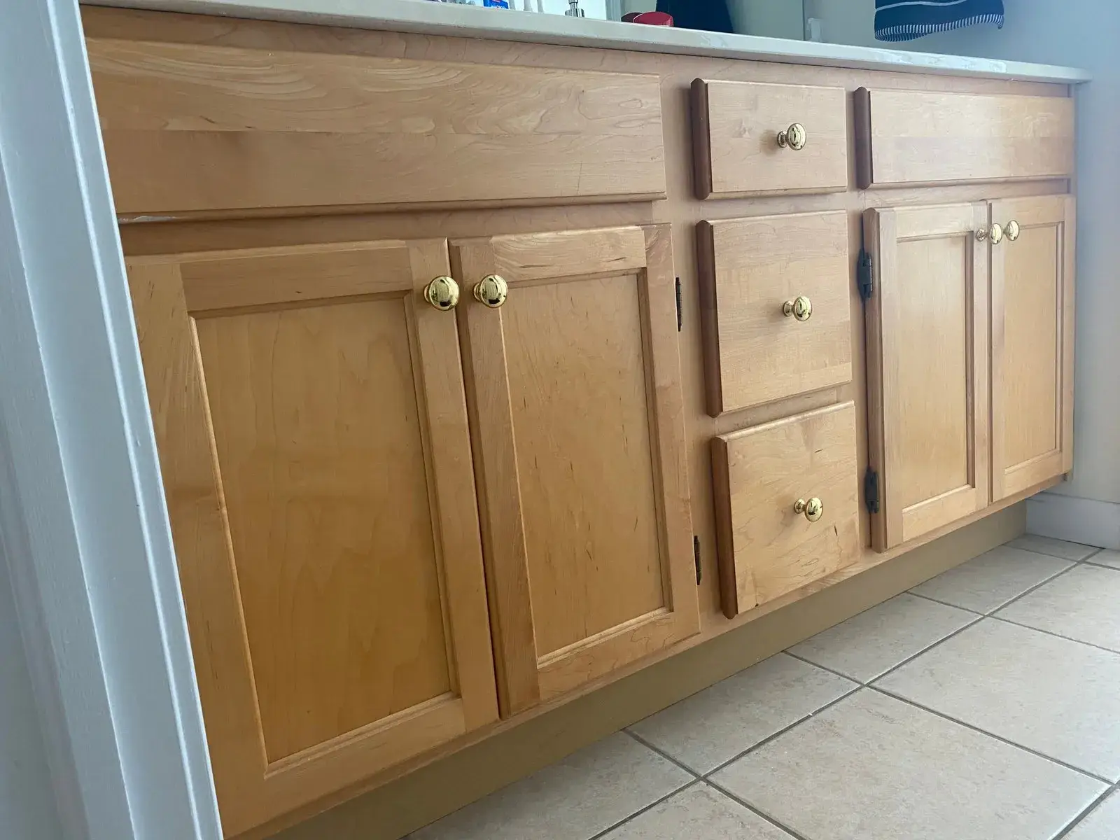 Before: staircase with black spindles, dining room and bedroom stripes, bathroom vanity