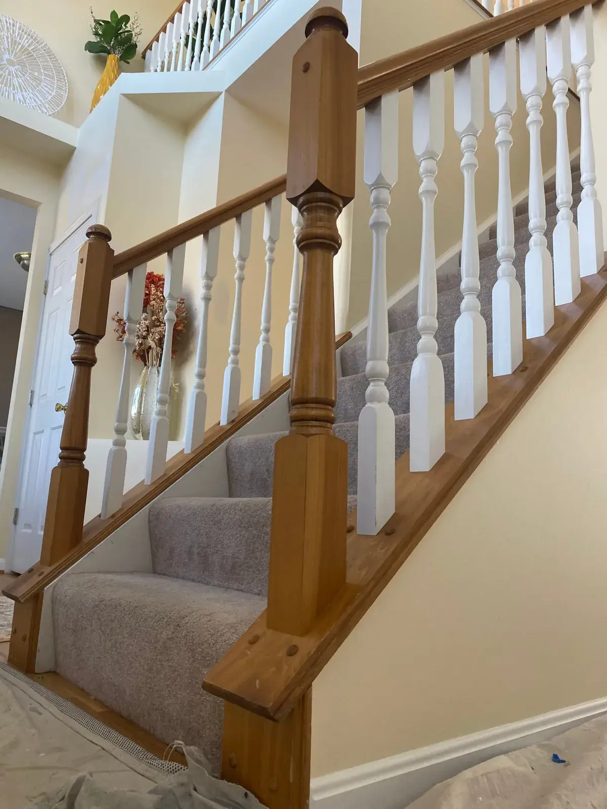 Before: staircase with black spindles, dining room and bedroom stripes, bathroom vanity