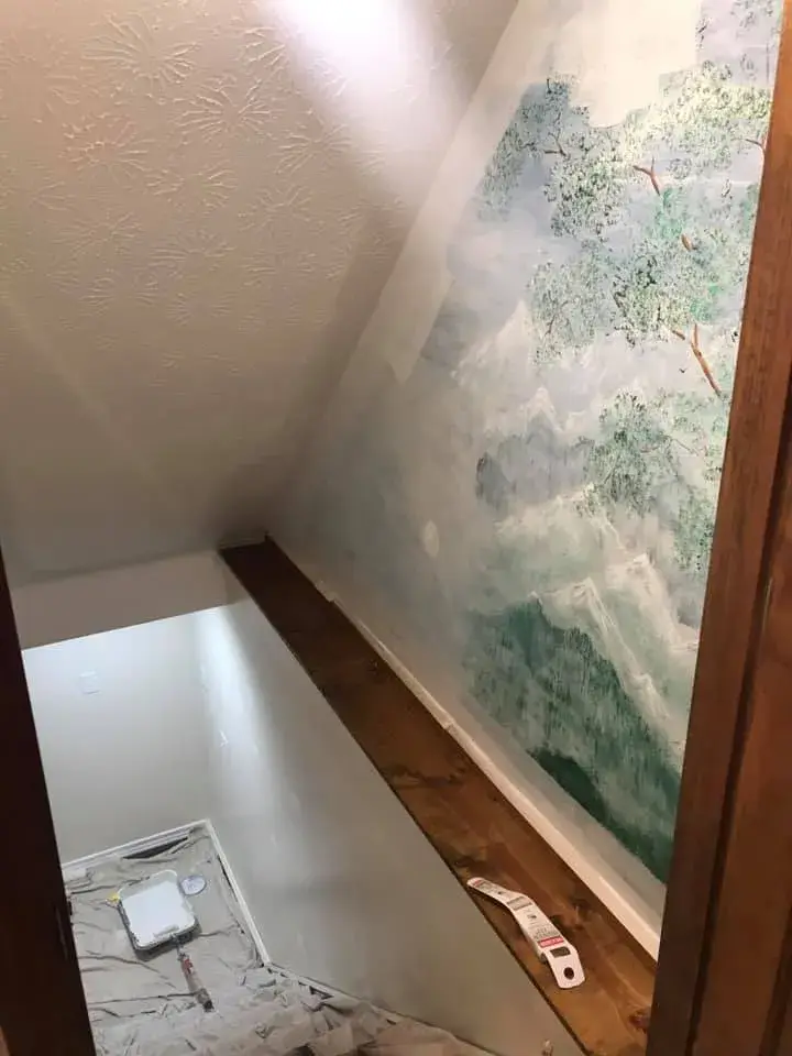 Before: stairwell mural painted over