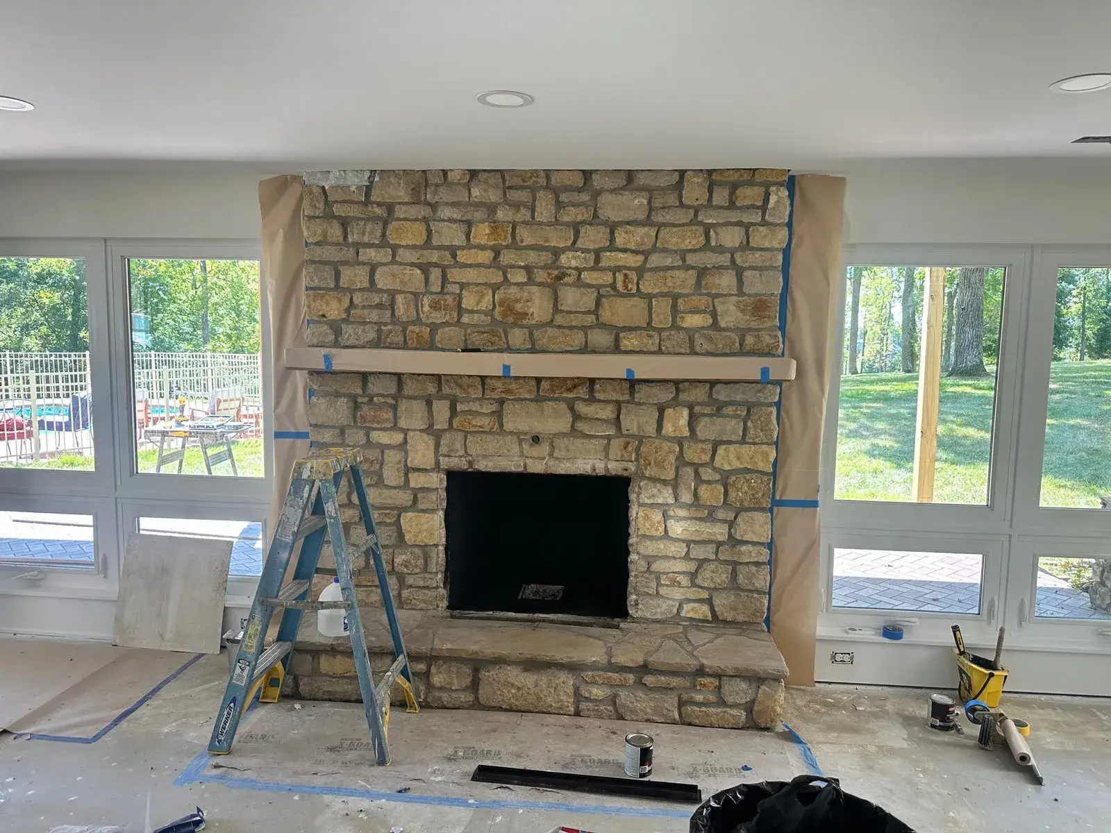 Before: stone fireplace limewashed
