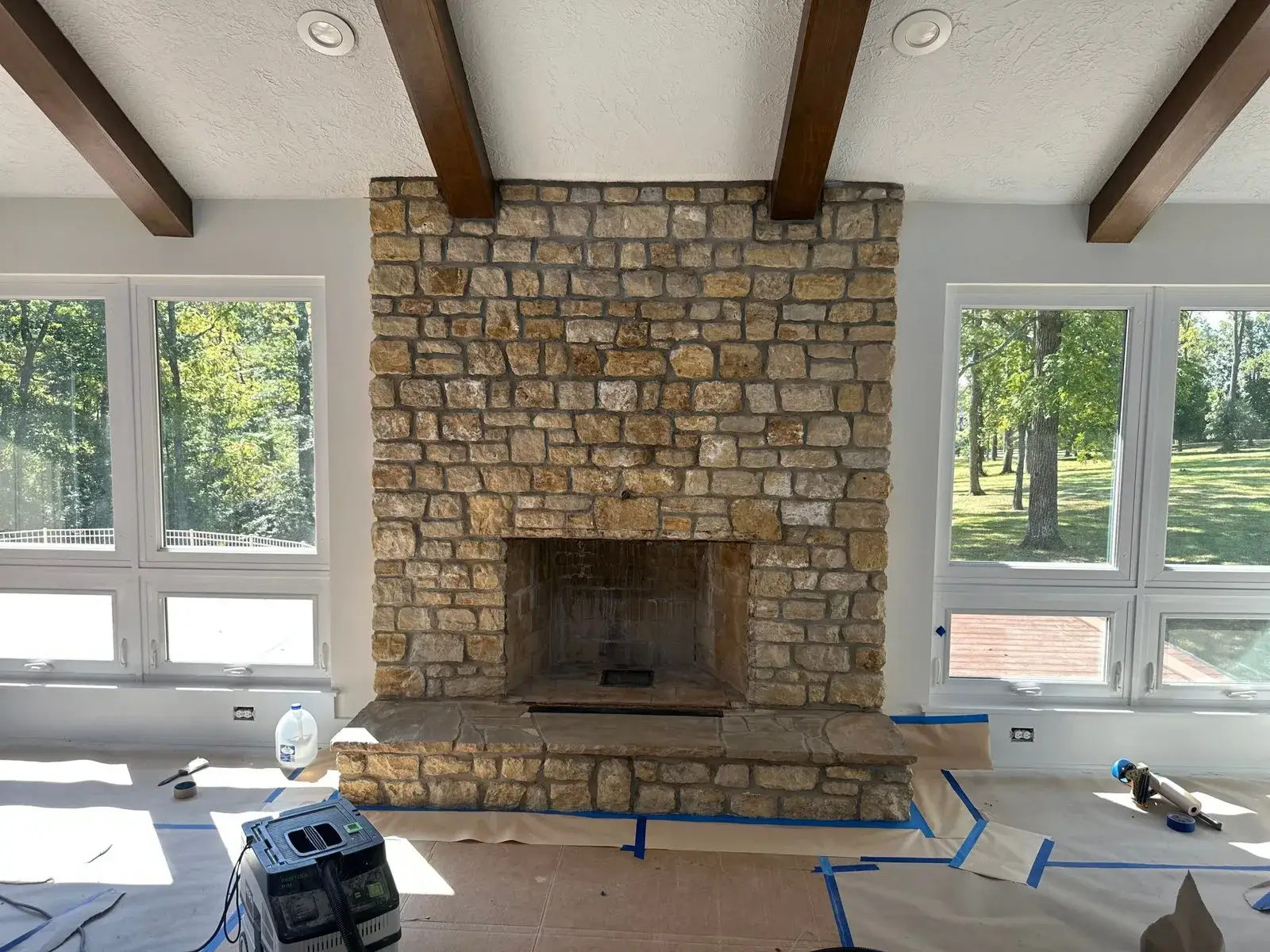 Before: stone fireplace limewashed