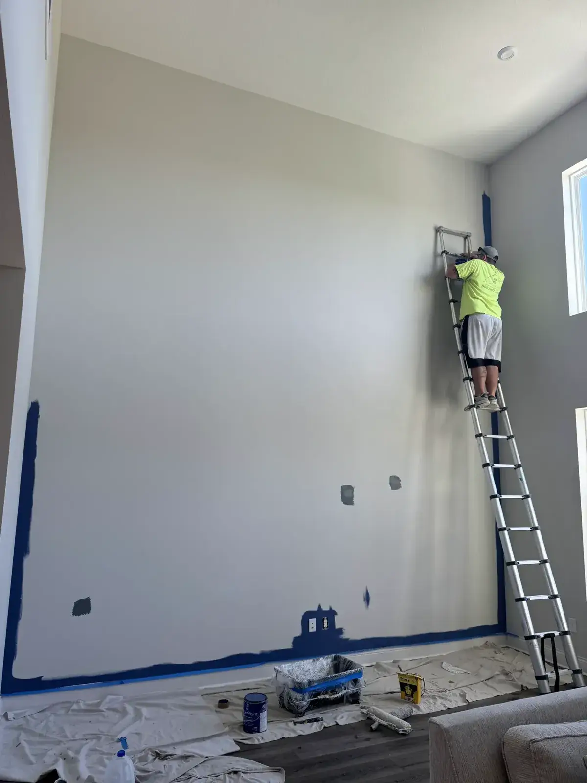 Before: two-story blue accent wall