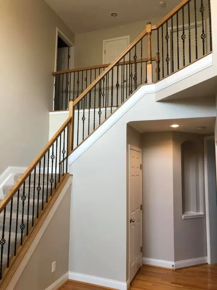 After: two-story foyer, stairwell and great room repainted; bedrooms painted beige