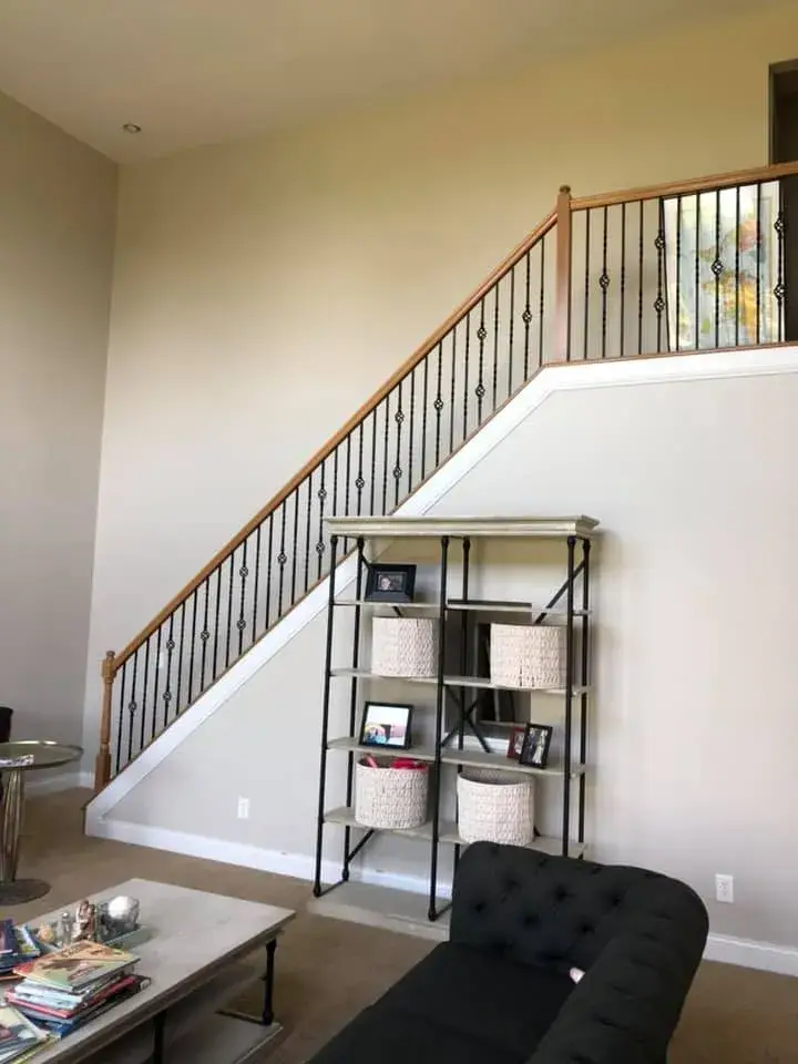 After: two-story foyer, stairwell and great room repainted; bedrooms painted beige