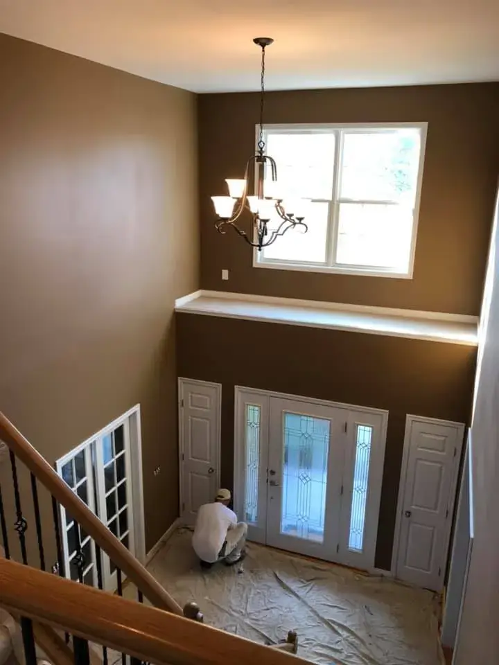 In progress: two-story foyer, stairwell and great room repainted; bedrooms painted beige