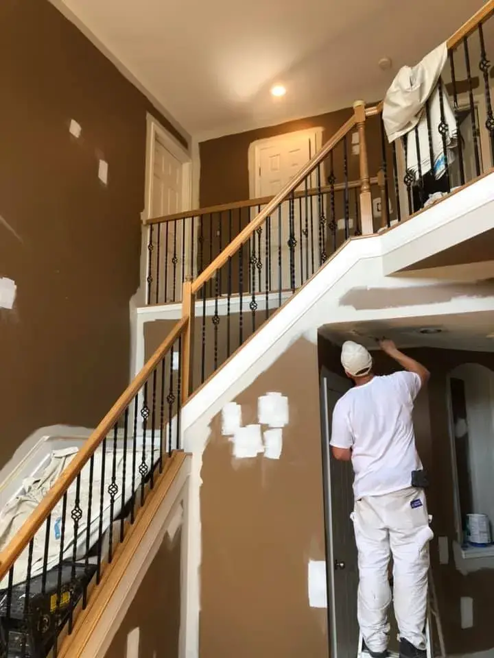 In progress: two-story foyer, stairwell and great room repainted; bedrooms painted beige