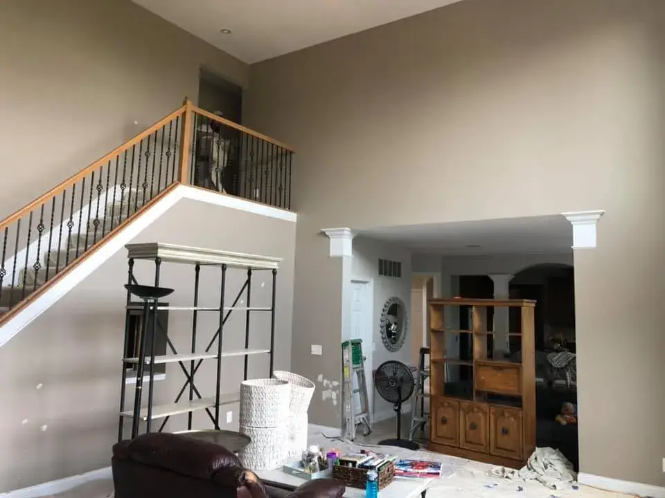 In progress: two-story foyer, stairwell and great room repainted; bedrooms painted beige