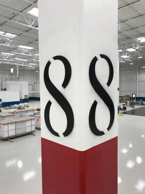 After: warehouse: tilt-up exterior walls and interior walls, columns and offices painted