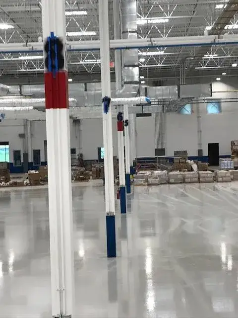 After: warehouse: tilt-up exterior walls and interior walls, columns and offices painted