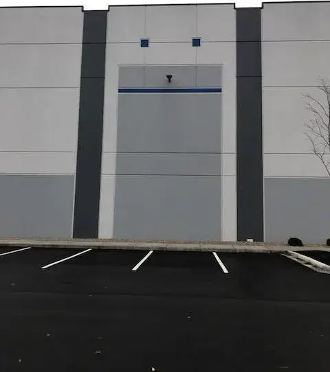 After: warehouse: tilt-up exterior walls and interior walls, columns and offices painted