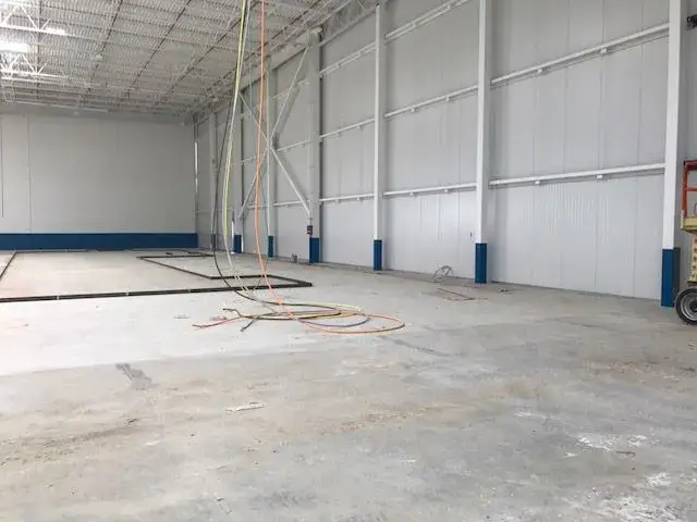 After: warehouse: tilt-up exterior walls and interior walls, columns and offices painted