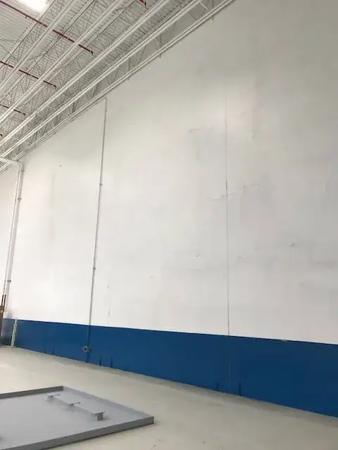 After: warehouse: tilt-up exterior walls and interior walls, columns and offices painted