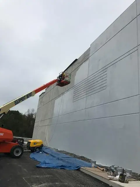 In progress: warehouse: tilt-up exterior walls and interior walls, columns and offices painted