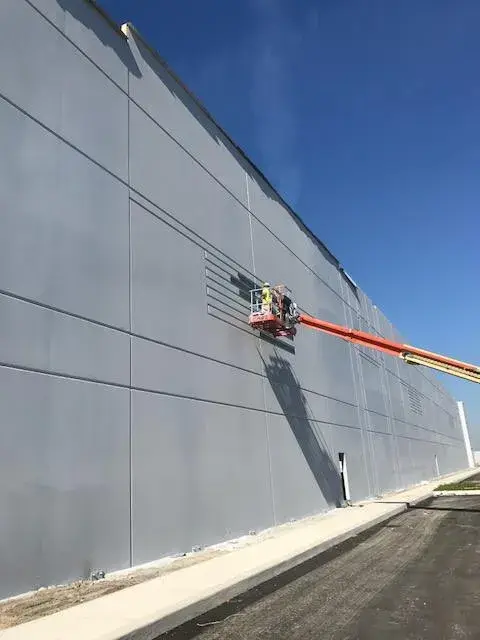 In progress: warehouse: tilt-up exterior walls and interior walls, columns and offices painted
